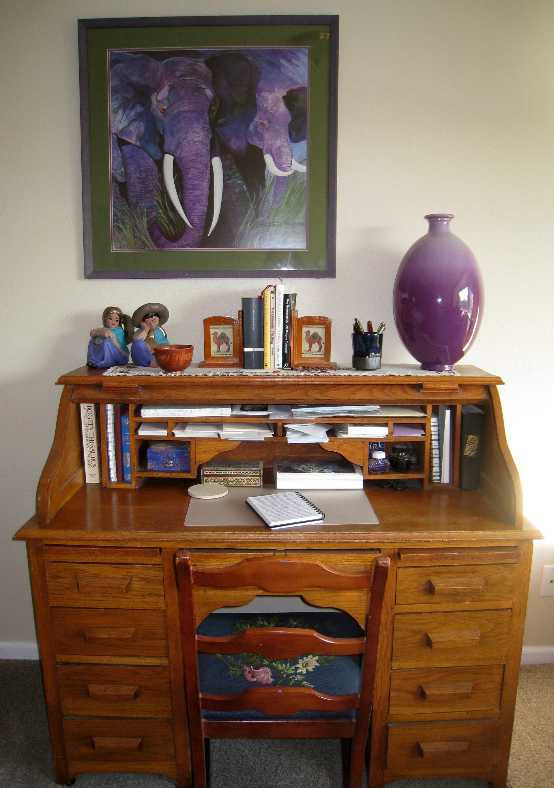 Hands reviewing documents and notes on a desk